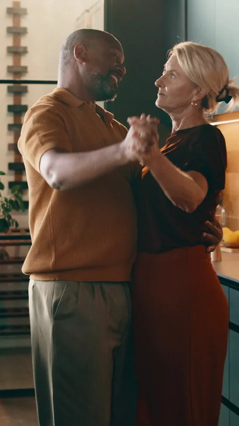 Dancing, kitchen or holding hands with happy couple in home for music, bonding Stock Footage 338049969