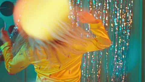 Dancing lady with a perfect smile dancing in pajama in front of the camera she Stock Footage 130340585