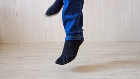 Dancing legs close-up, bottom view. The teenager is dancing. Video stock 123730116