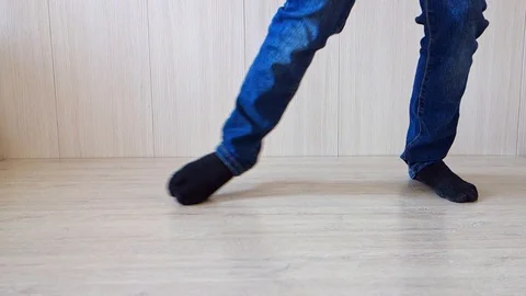 Dancing legs close-up, bottom view. The teenager is dancing. Video stock 124013111