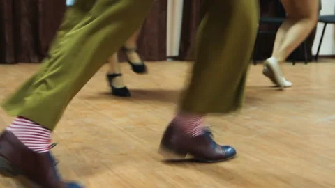 Dancing legs close up. Dancers perform lindy hop dance at the swing festival. Video stock 107210149
