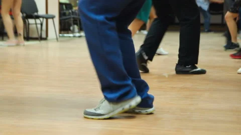 Dancing legs close up. Dancers perform boogie woogie dance at the swing festival Video stock 107210273