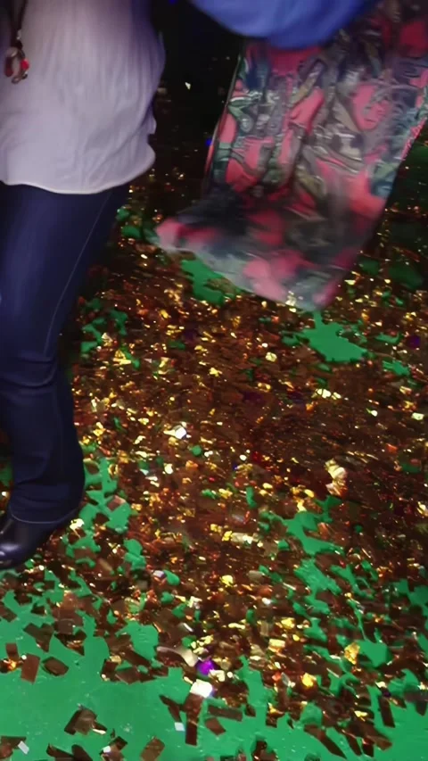 Dancing legs of a merry group enjoying a festive party on a glittery floor Stock Footage 289390129