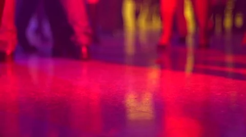Dancing legs in spot lights rays lumiere on a disco Stock Footage 46026625