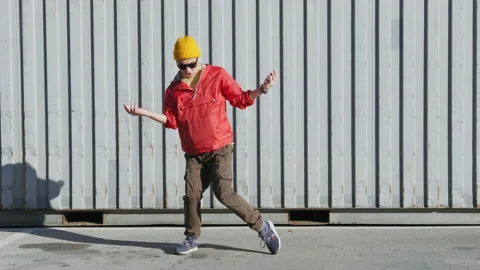 Dancing man funny break dance, happy rhythmically waving his arms Stock Footage 144121085