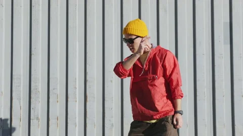 Dancing man funny break dance, happy rhythmically waving his arms Stock Footage 144121400