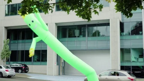 Dancing man in Seattle with cars going by in background Stock Footage 73498384