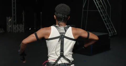Dancing man wearing motion capture suit in studio actor wearing mo-cap suit for Stock Footage 138391201