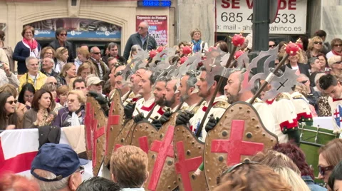 Dancing men behind shields and axes start walking at parade Stock Footage 47966811