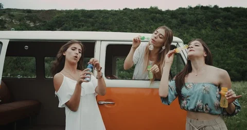 Dancing to the music feeling the beat, having a bubble party with friends. 4k Stock Footage 112510248
