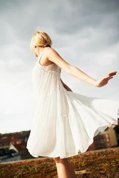 Dancing like no-ones around. Low angle shot of a gorgeous young woman twirling Stock Photos