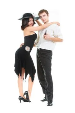 Dancing pair, a young lady in a black retro dress and hat, and a gentleman wi Foto stock