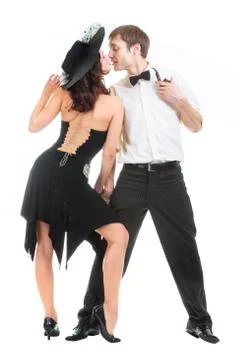 Dancing pair, a young lady in a black retro dress and hat, and a gentleman wi Foto stock