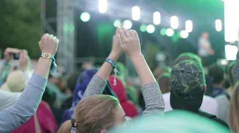 Dancing people  are capturing video on smartphone and clapping at the concert Stock Footage 66521690