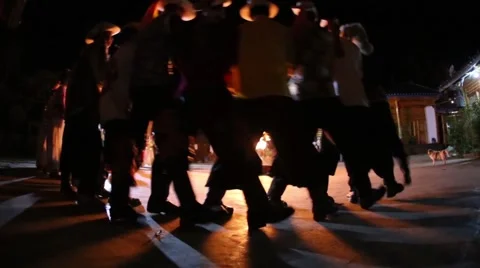 Dancing people around the fire in the square Stock Footage 49175918