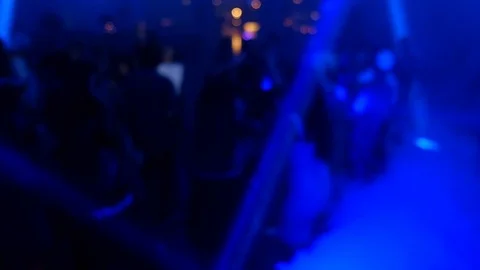Dancing people out of focus.Laser show HD video Stock Footage 99452826
