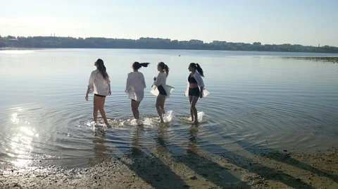 Dancing performance on water of four girls near beach Stock Footage 65300963
