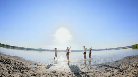 Dancing performance on water of four girls near beach Stock Footage 65322244