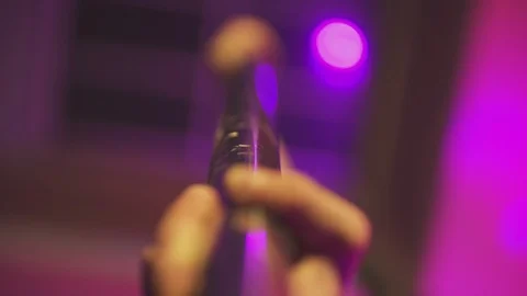 Dancing pole close up, changing focus with hands holding it. Slow motion. Stock Footage 116329241