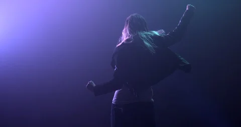 Dancing pumping her first in the air at a rave Stock Footage 97516822