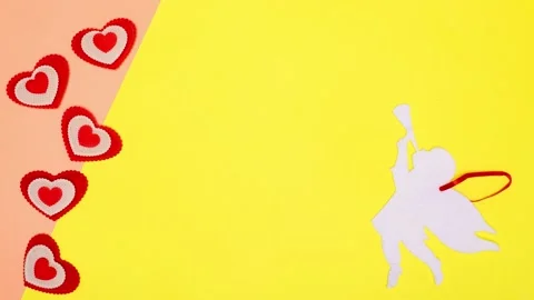 Dancing red hearts as a declaration of love, next to a white angel. Stock Footage 150084418