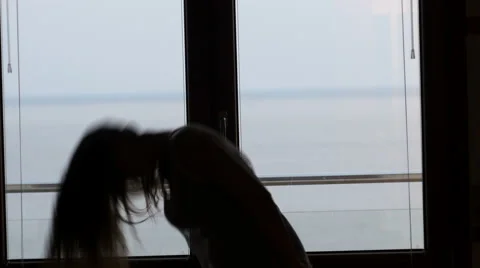 Dancing silhouette in front of a window Stock Footage 62733941