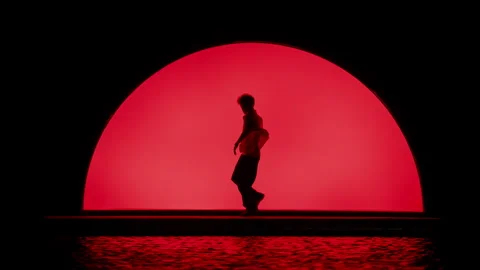 Dancing Silhouette On Red Stage Stock Footage 255537412
