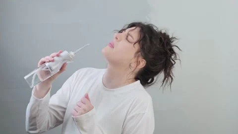 Dancing singing and clean teeth with a water flosser. A fun morning starts with Stock Footage 307306589