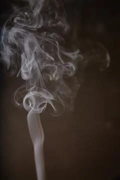 Dancing Smoke Patterns against Dark Backdrop Stock Photos