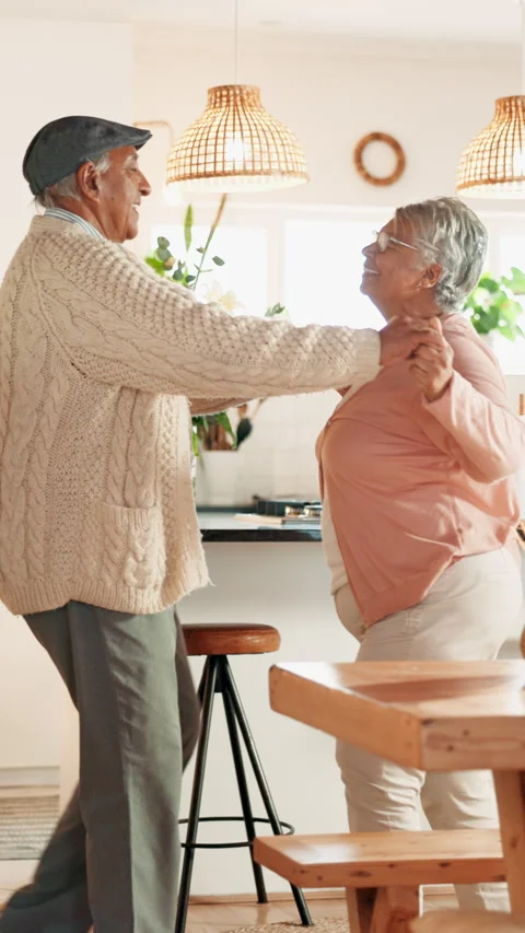 Dancing, spin and senior couple in kitchen at house listening to music, radio or Stock Footage 343613871