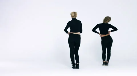 Dancing two girls on a white background in studio. 4K 30fps ProRes (HQ) Video stock 66909098
