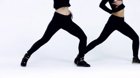 Dancing two girls on a white background in studio. 4K 30fps ProRes (HQ) Video stock 66909101
