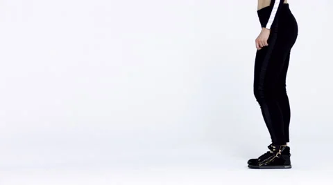 Dancing two girls on a white background in studio. 4K 30fps ProRes (HQ) Video stock 66909591