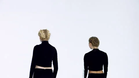 Dancing two girls on a white background in studio Video stock 66909982