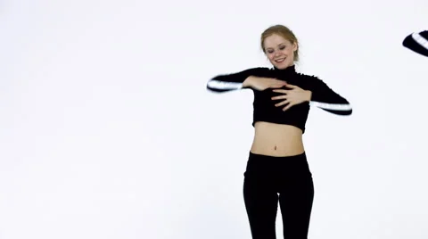 Dancing two girls on a white background in studio Stock Footage 66909998