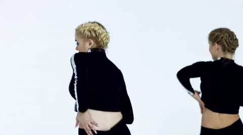 Dancing two girls on a white background in studio Video stock 66910372