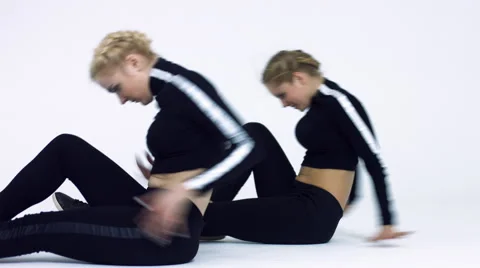 Dancing two girls on a white background in studio Video stock 66910440