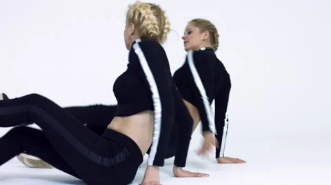Dancing two girls on a white background in studio Video stock 66910485