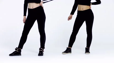 Dancing two girls on a white background in studio. 4K 30fps ProRes (HQ) Video stock 66910803