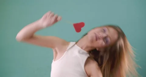 Dancing while licking the lollipop Stock Footage 160159294