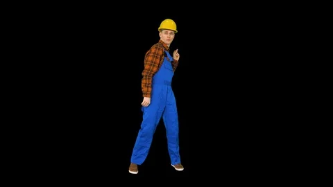 Dancing young engineer with helmet after work, Alpha Channel Stock-Footage 115996223