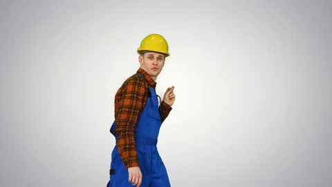 Dancing young engineer with helmet after work on gradient background. Video stock 130700120