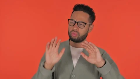 Dancing Young Hispanic Man on Red Background, Portrait Vidéo 295902358