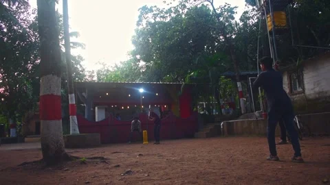 Dandeli, Karnataka- 6th december 2024:Group of fiends playing cricket in th.. Stock Footage 341346984
