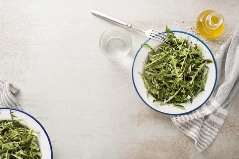 Dandelion salad with dressing Stock Photos