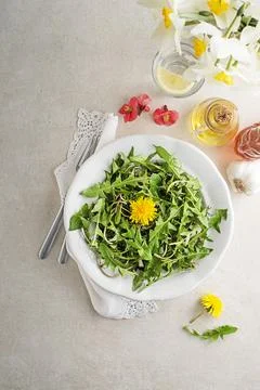 Dandelion salad with dressing Stock Photos