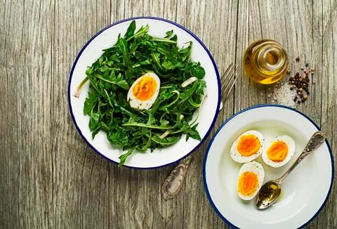Dandelion salad with eggs Stock Photos