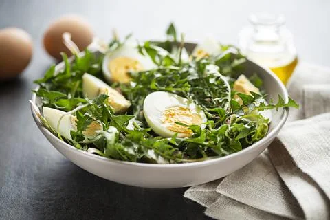 Dandelion salad with eggs Stock Photos