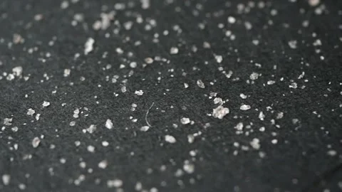 Dandruff and hairs on black background Stock Footage 216877482