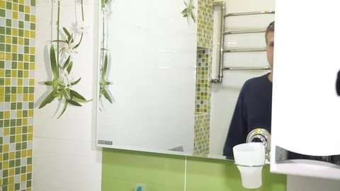 Dandruff on the head. Young man in the restroom room Stock Footage 99283361